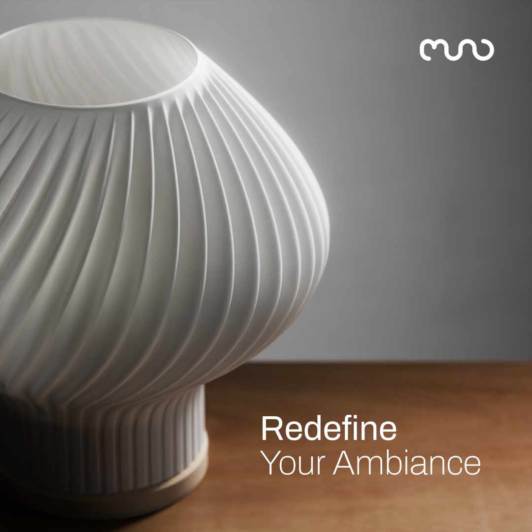 3D printed lamp placed on a table. Text overlay on top: "Redefine Your Ambiance"